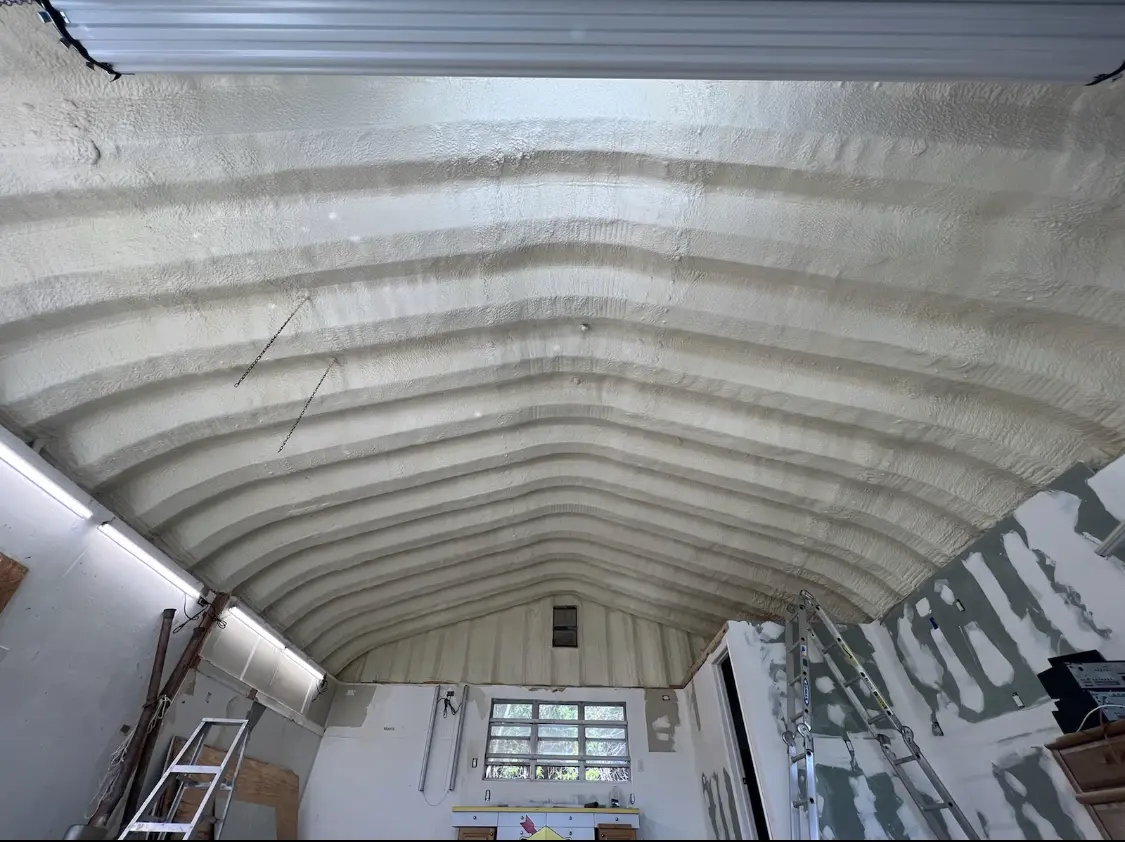 Spray polyurethane foam applied to the underside of a metal roof deck in Maryville